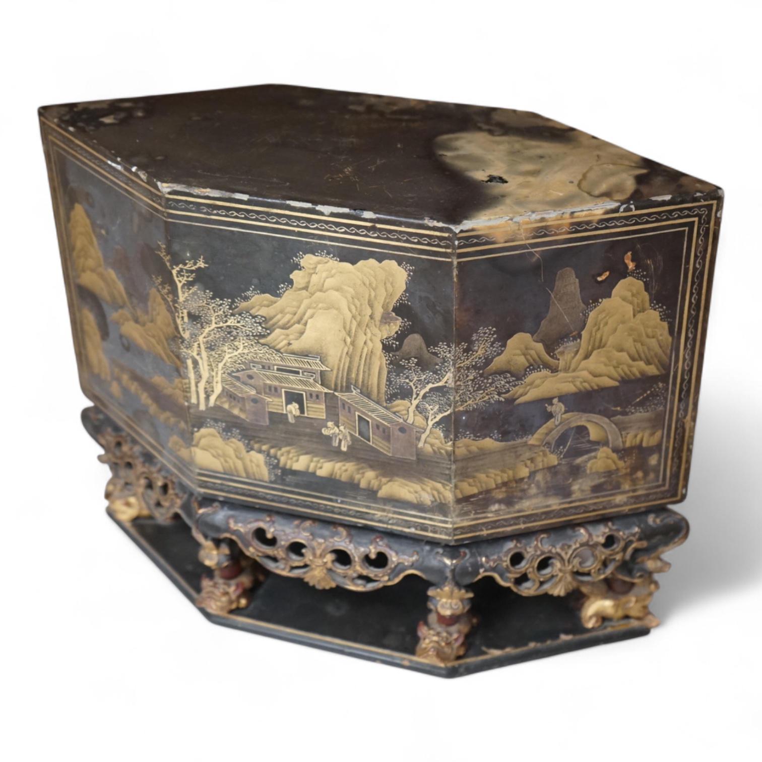 A Chinese lacquered and carved wood temple ornament, 26.5cm high, 32cm widest on base.